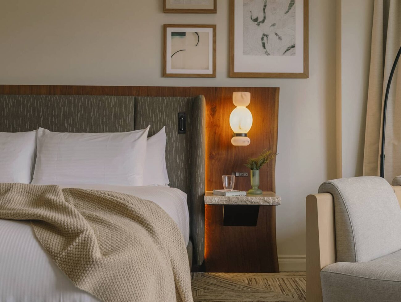 A tranquil Luxury peak view room at Rimrock Banff featuring soft lighting, natural wood accents, and an inviting atmosphere inspired by the mountains.