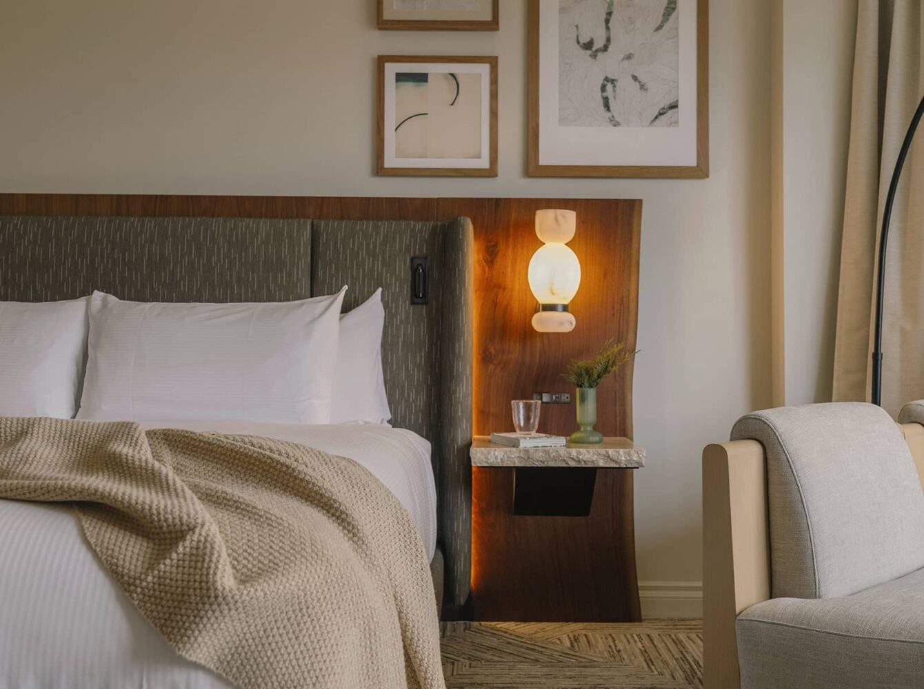 A tranquil Luxury peak view room at Rimrock Banff featuring soft lighting, natural wood accents, and an inviting atmosphere inspired by the mountains.