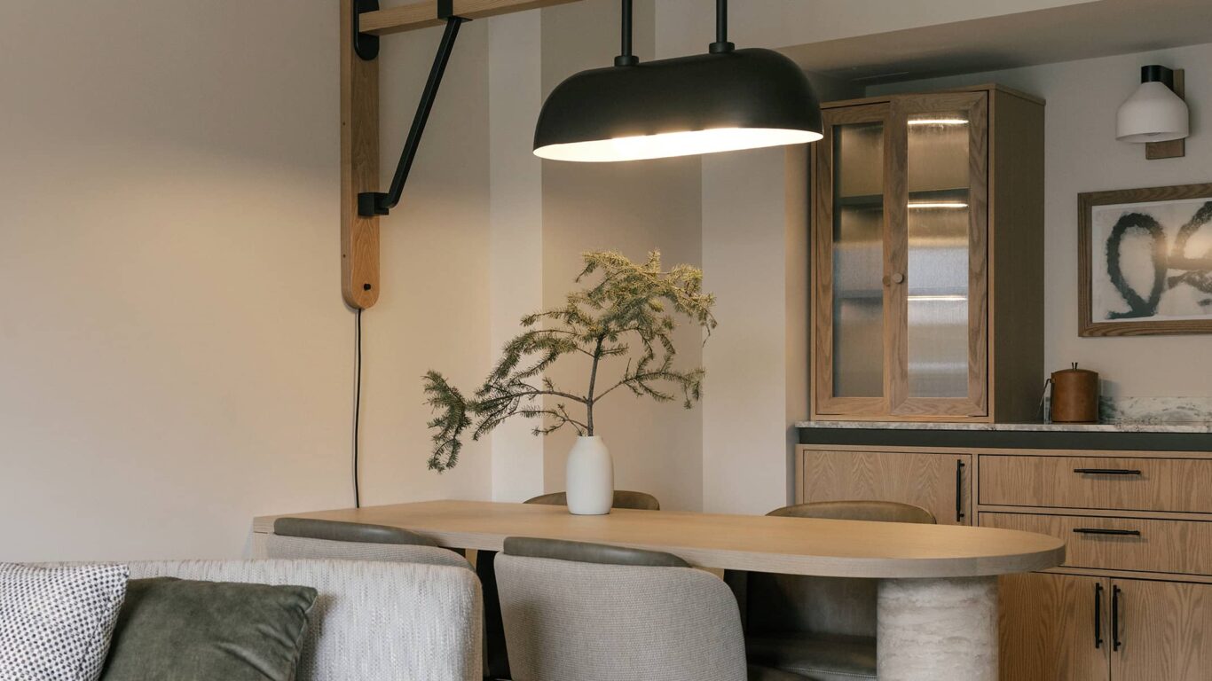 Spacious suite living area at Rimrock Banff, Emblems Collection featuring elegant furnishings and mountain-inspired design.