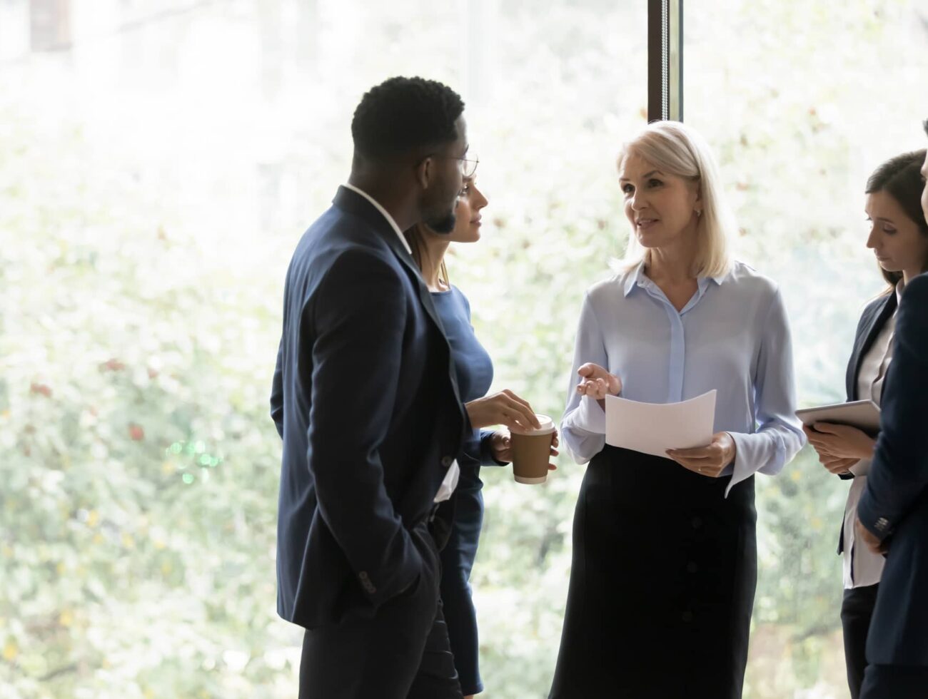 Small group discussion underway in the Compass meeting room at Rimrock Banff.