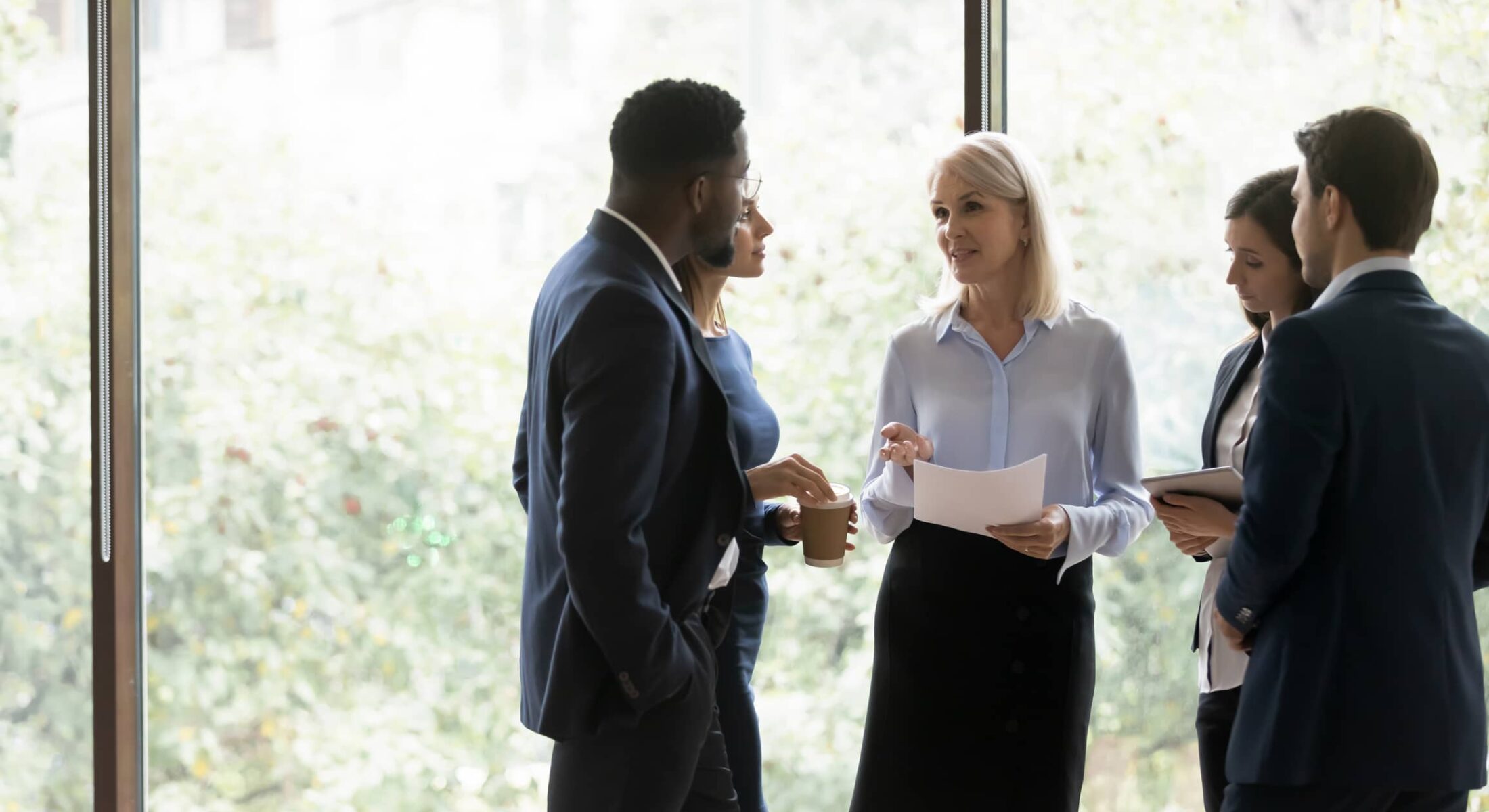 Small group discussion underway in the Compass meeting room at Rimrock Banff.