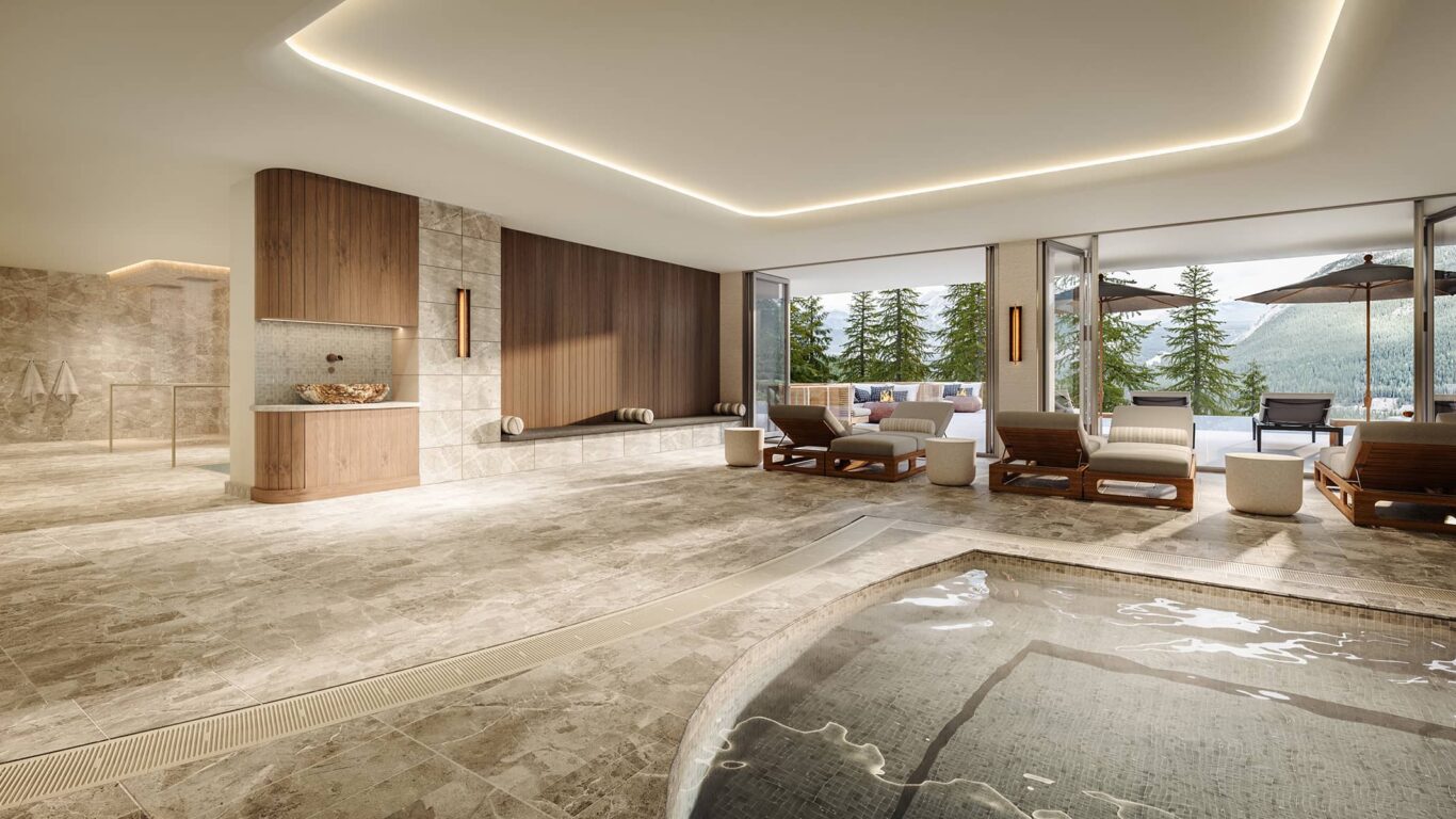 Indoor wellness area at Rimrock Banff, Emblems Collection featuring a warm hydrotherapy pool, lounge chairs, and floor-to-ceiling windows opening to forest and mountain views.