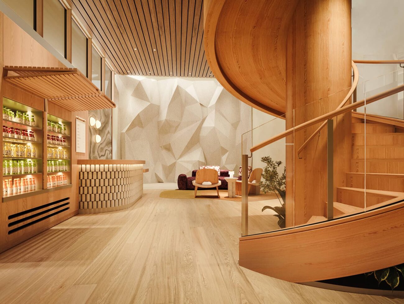 The wellness reception at Rimrock Banff, Emblems Collection features a curved wooden staircase, a juice bar with bottled drinks, seating area, and sculpted climbing wall.