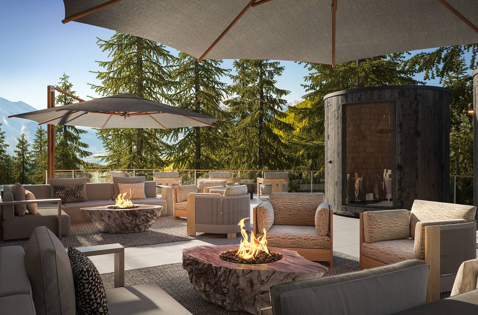 Outdoor terrace at Rimrock Banff, Emblems Collection with barrel saunas, firetables, and lounge seating surrounded by forest and mountain views.
