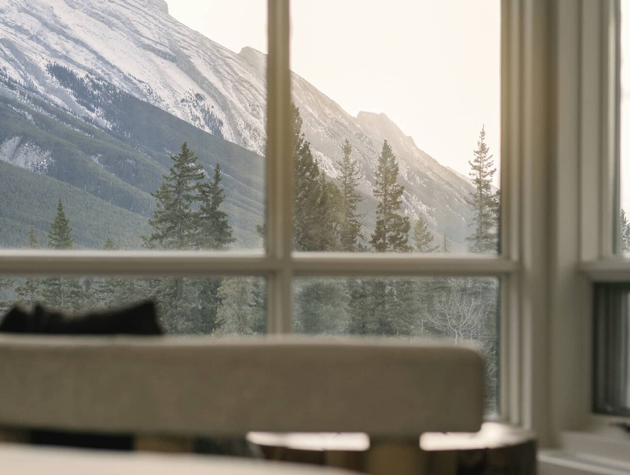 Bedroom view at Rimrock Banff, Emblems Collection showcasing Mount Rundle and the beauty of Banff National Park.
