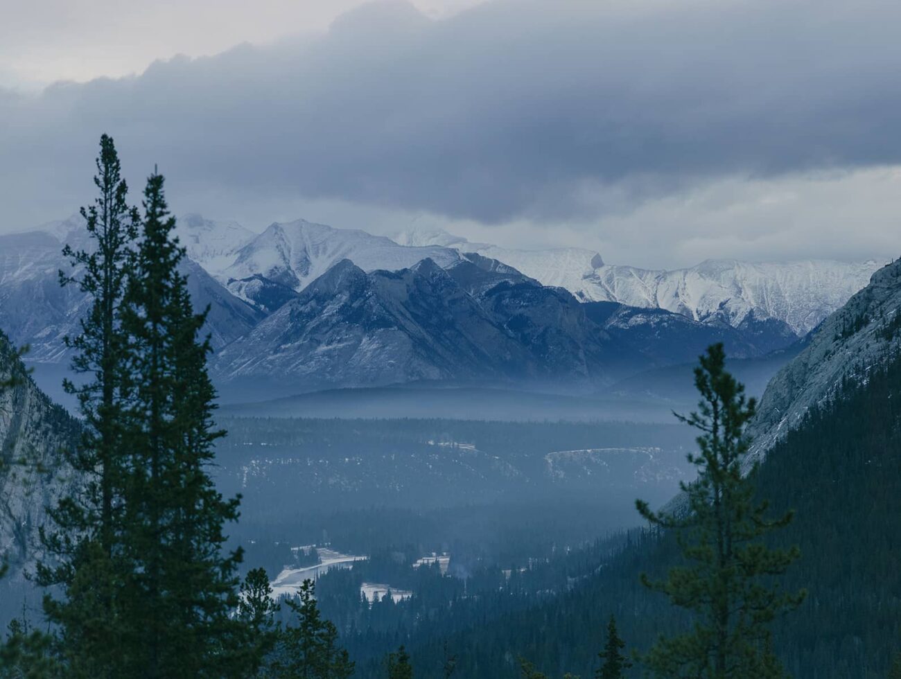 Video of Rimrock Banff guest rooms glowing with soft golden light, capturing cozy comfort, refined style, and the warmth of mountain luxury.