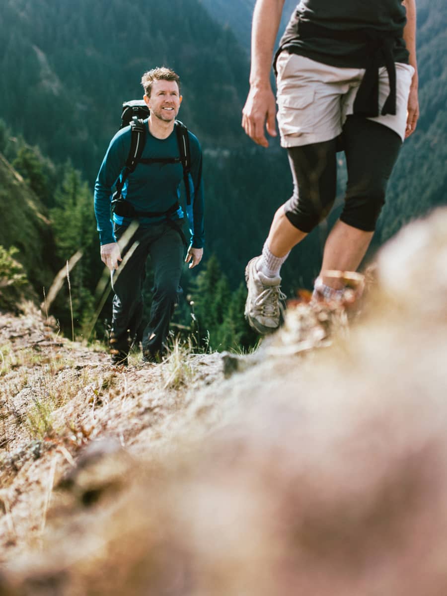 A couple enjoyes back country hiking in the Canadian Rockies