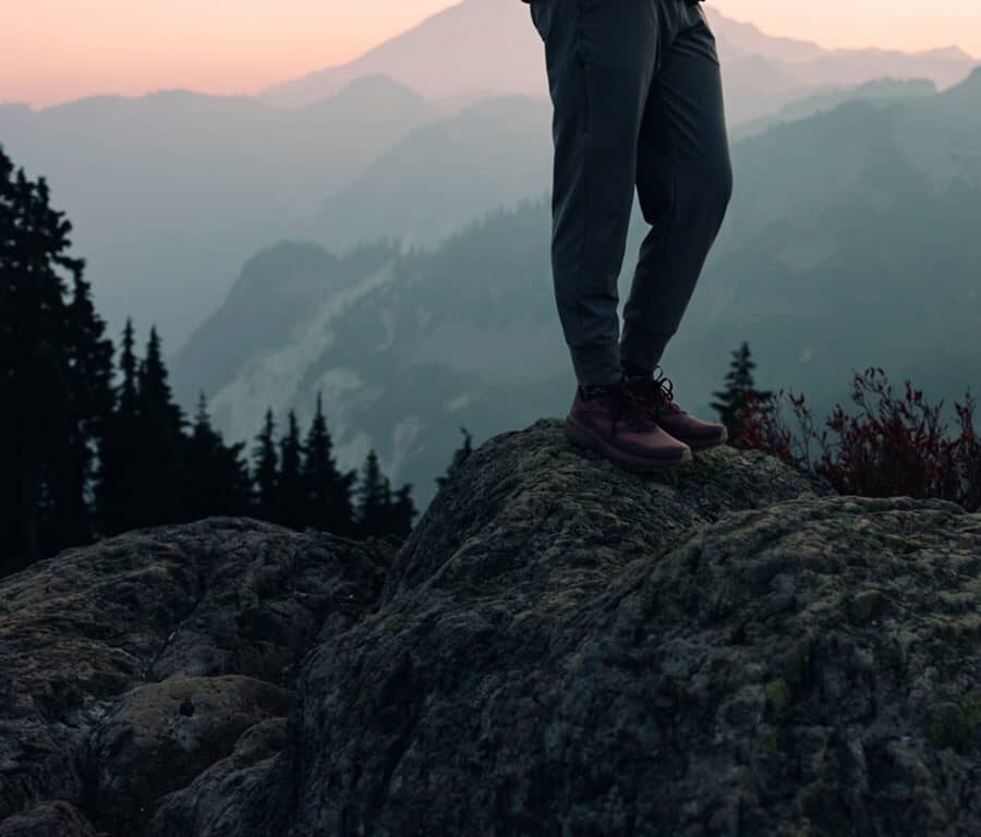 Luxury travel means a woman enjoys a hike on a beautiful Autumn day on Sulphur Mountian in Banff National Park.