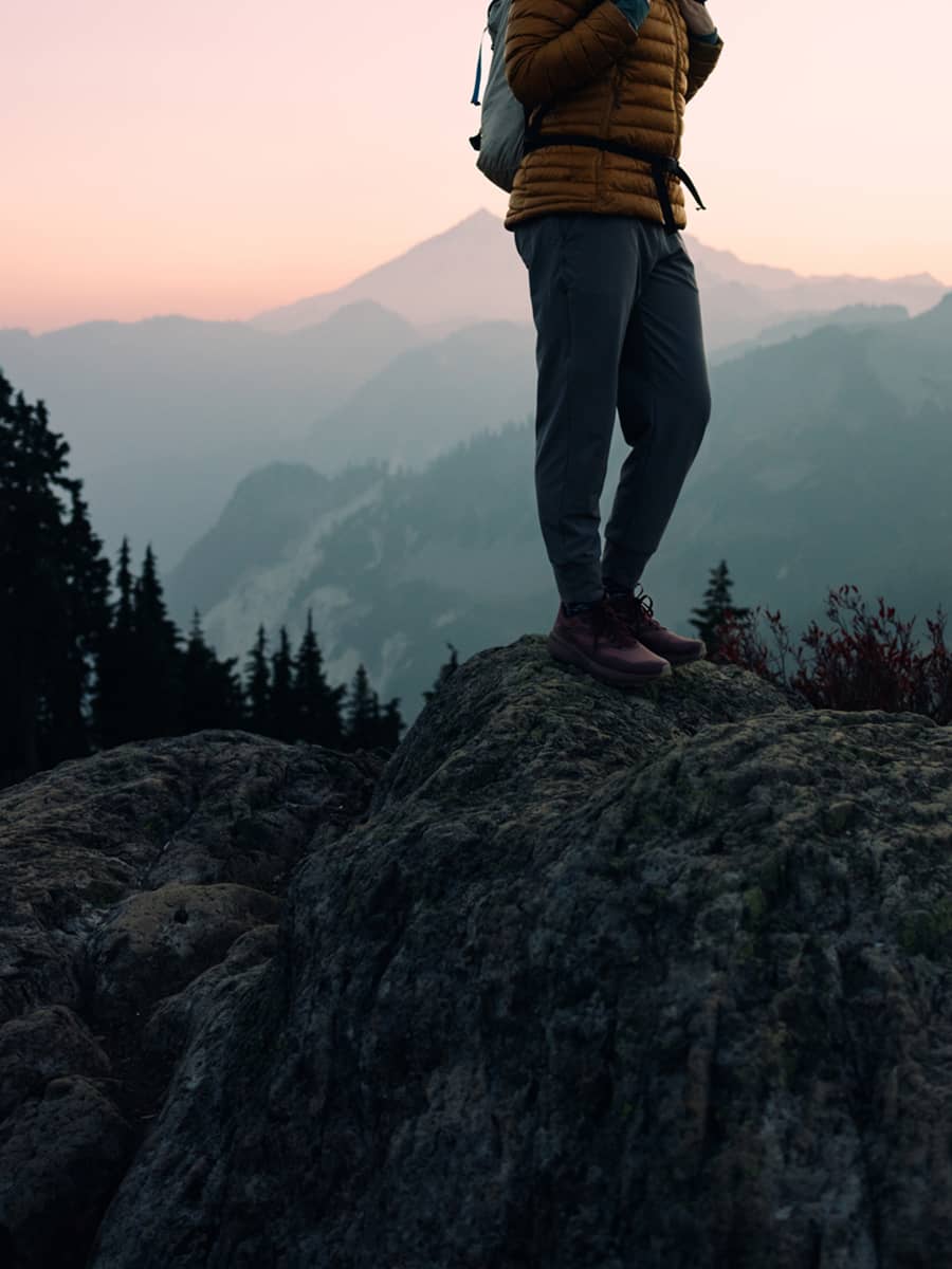 A woman enjoys a hike on a beautiful Autumn day on Sulphur Mountian in Banff National Park.