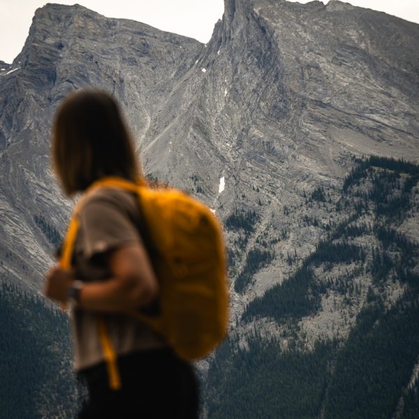 A woman hiking in the Canadian Rockies in Banff National Park on a guided tour with Rimrock Banff
