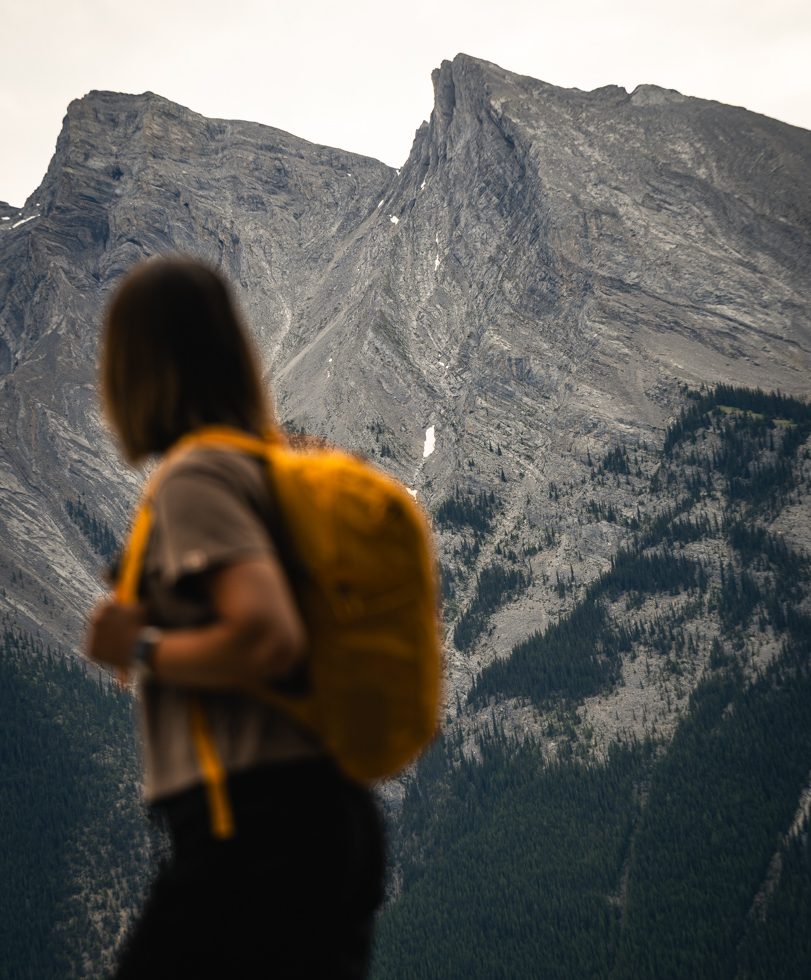 A woman hiking in the Canadian Rockies in Banff National Park on a guided tour with Rimrock Banff