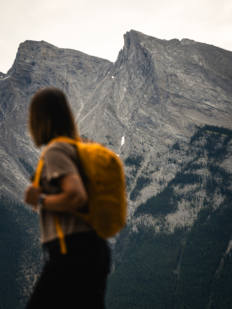 A woman hiking in the Canadian Rockies in Banff National Park on a guided tour with Rimrock Banff