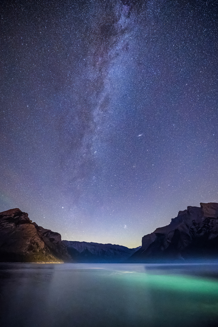 Lake Minnewanka and stars at night in Banff National Park