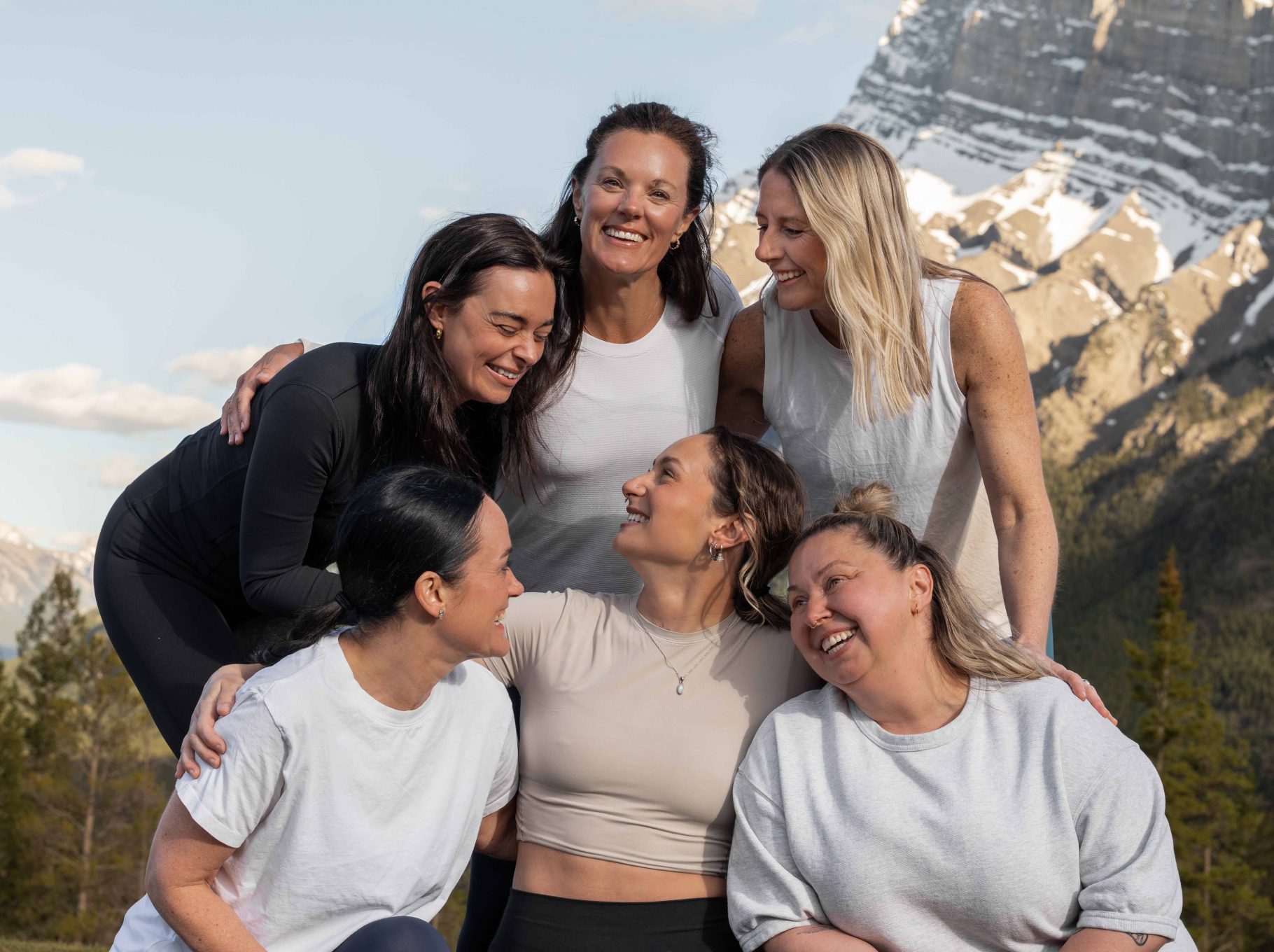 Guests gather after wellness classes at Rimrock Banff, connecting through movement against the backdrop of the Canadian Rockies.