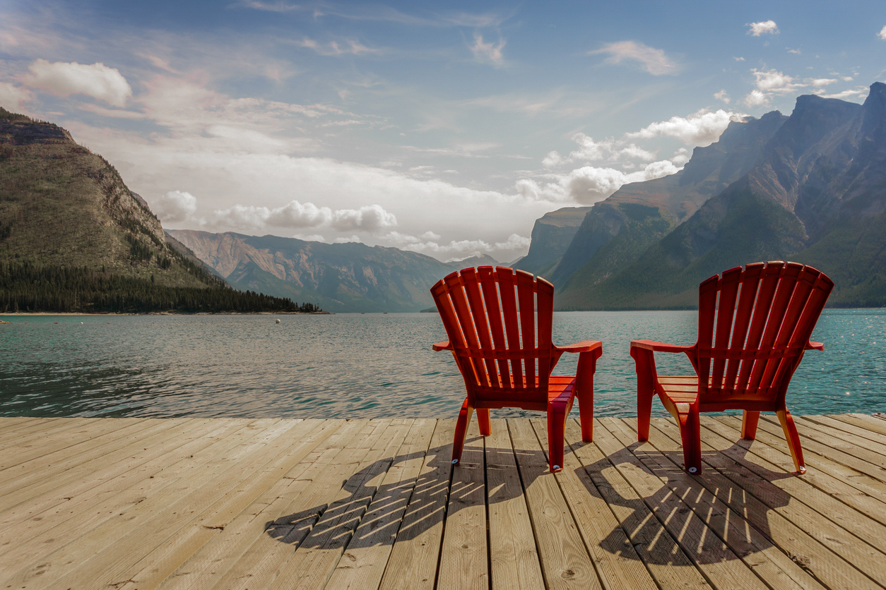 Jetty with red chairs by Minnewanka Lake, Banff National Park, Alberta, Canada