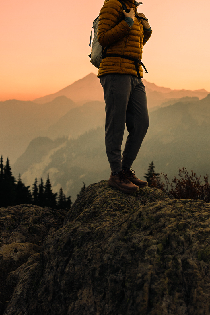 Luxury travel means a woman enjoys a hike on a beautiful Autumn day on Sulphur Mountian in Banff National Park.