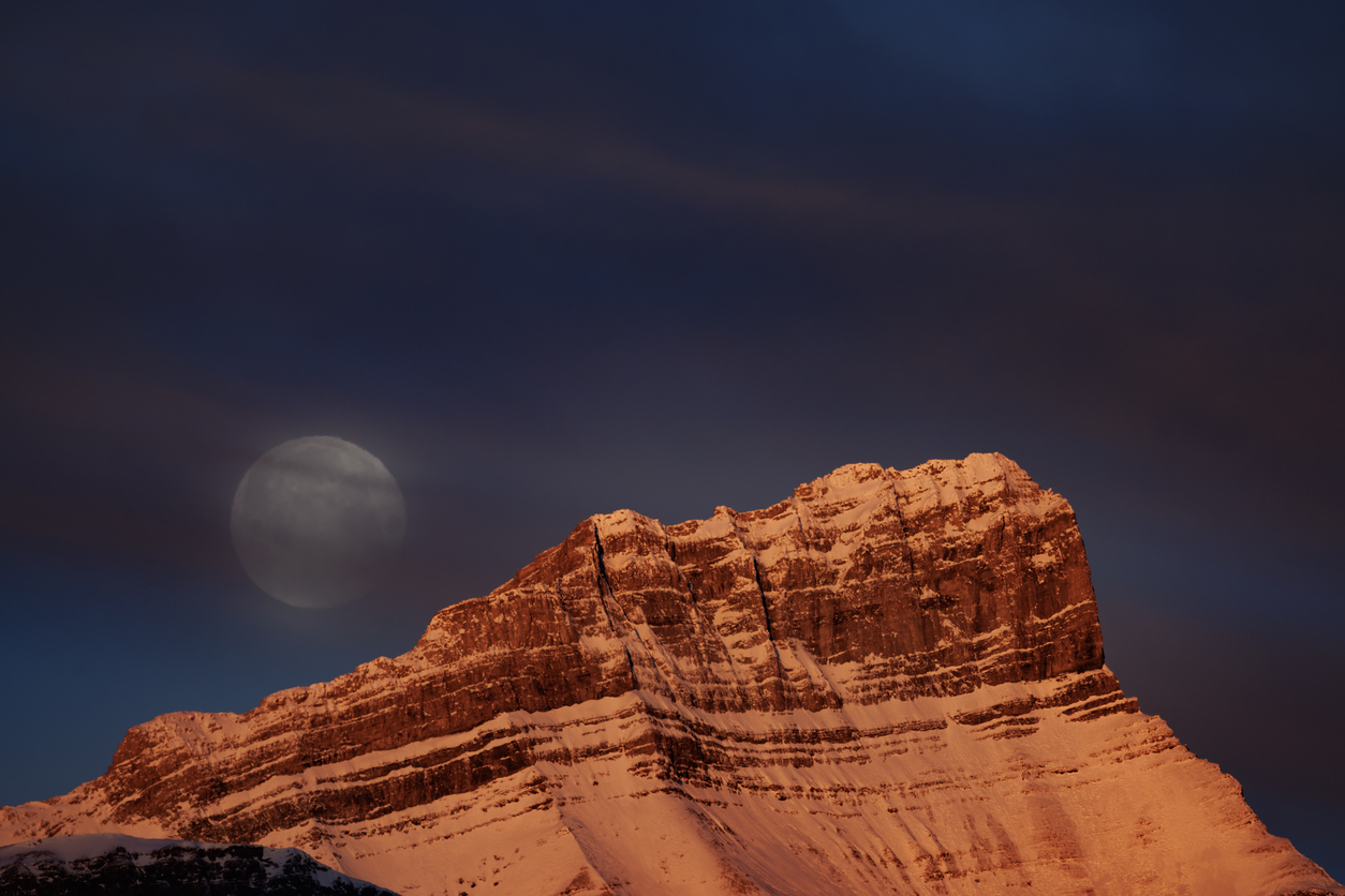 The Wolf Moon sets over Mount Rundle in Banff National Park near Banff, Alberta, Canada, in January. The Wolf Moon is the first full moon of the calendar year.