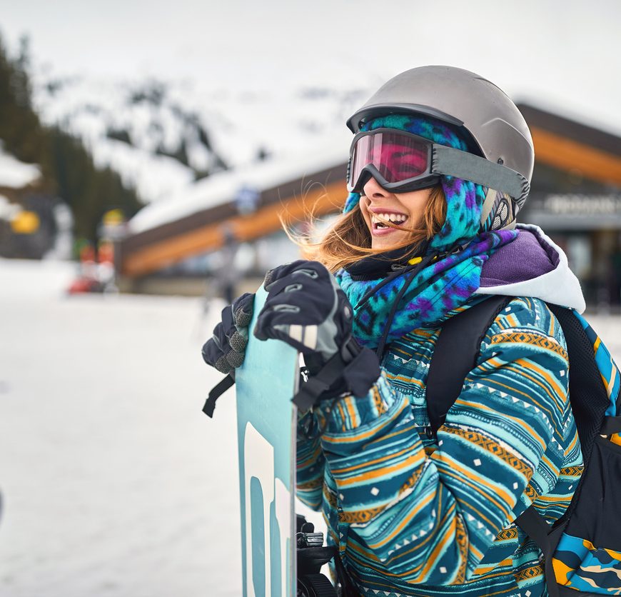A woman with her ski and snowboard rentals at Sunshine in Banff National Park