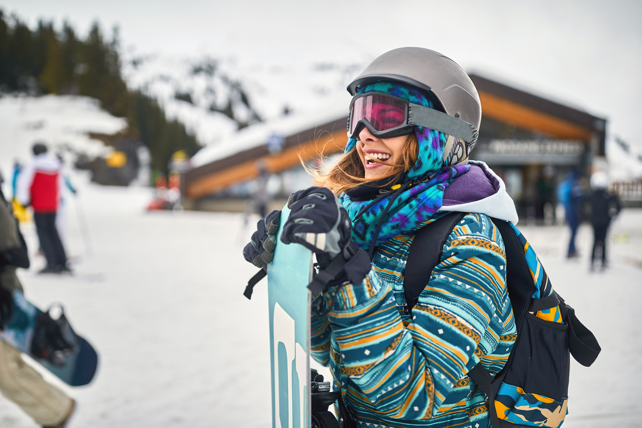 A woman with her ski and snowboard rentals at Sunshine in Banff National Park